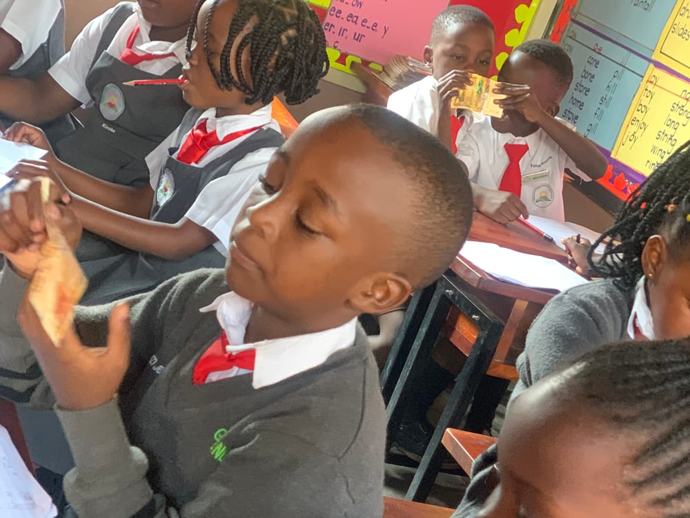 Upper primary learners working through a class exercise